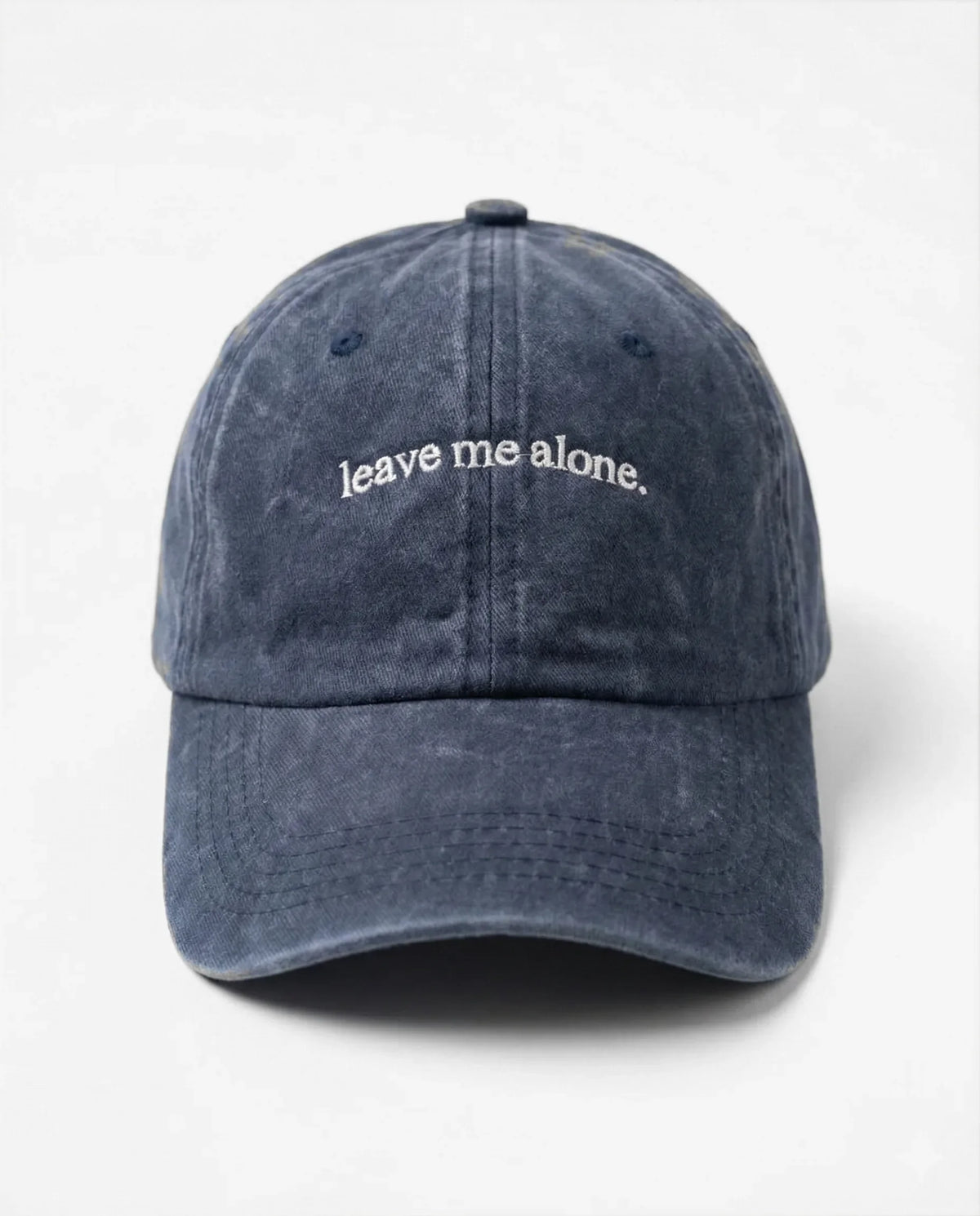 Leave me alone. dad hat in Blu navy, front view: embroidered 'leave me alone.' lettering, washed cotton