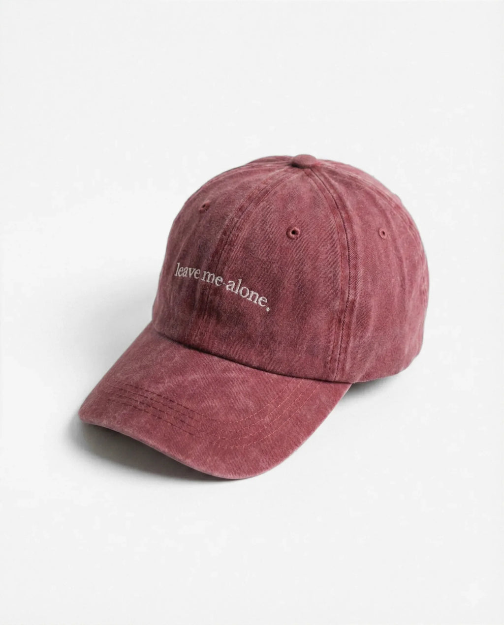 Leave me alone. dad hat in Burgundy, side view: embroidered 'leave me alone.' lettering, washed cotton