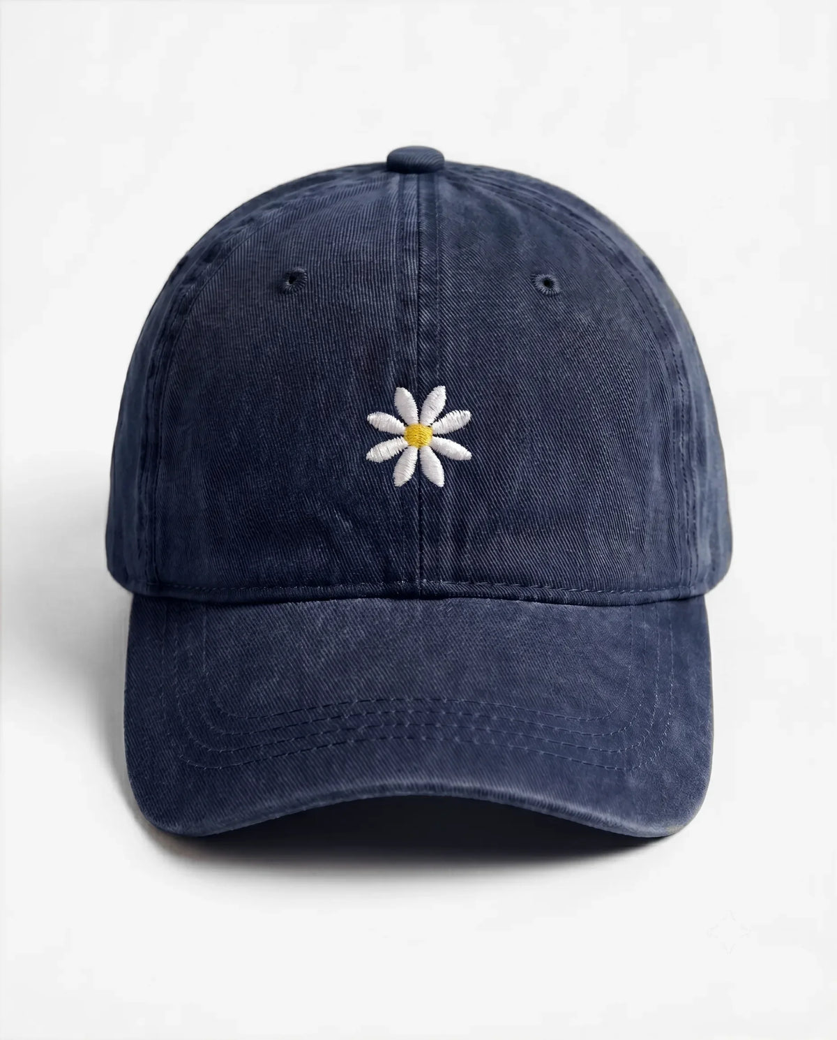 The Daisy dad hat in Blu navy, front view: embroidered daisy, washed cotton