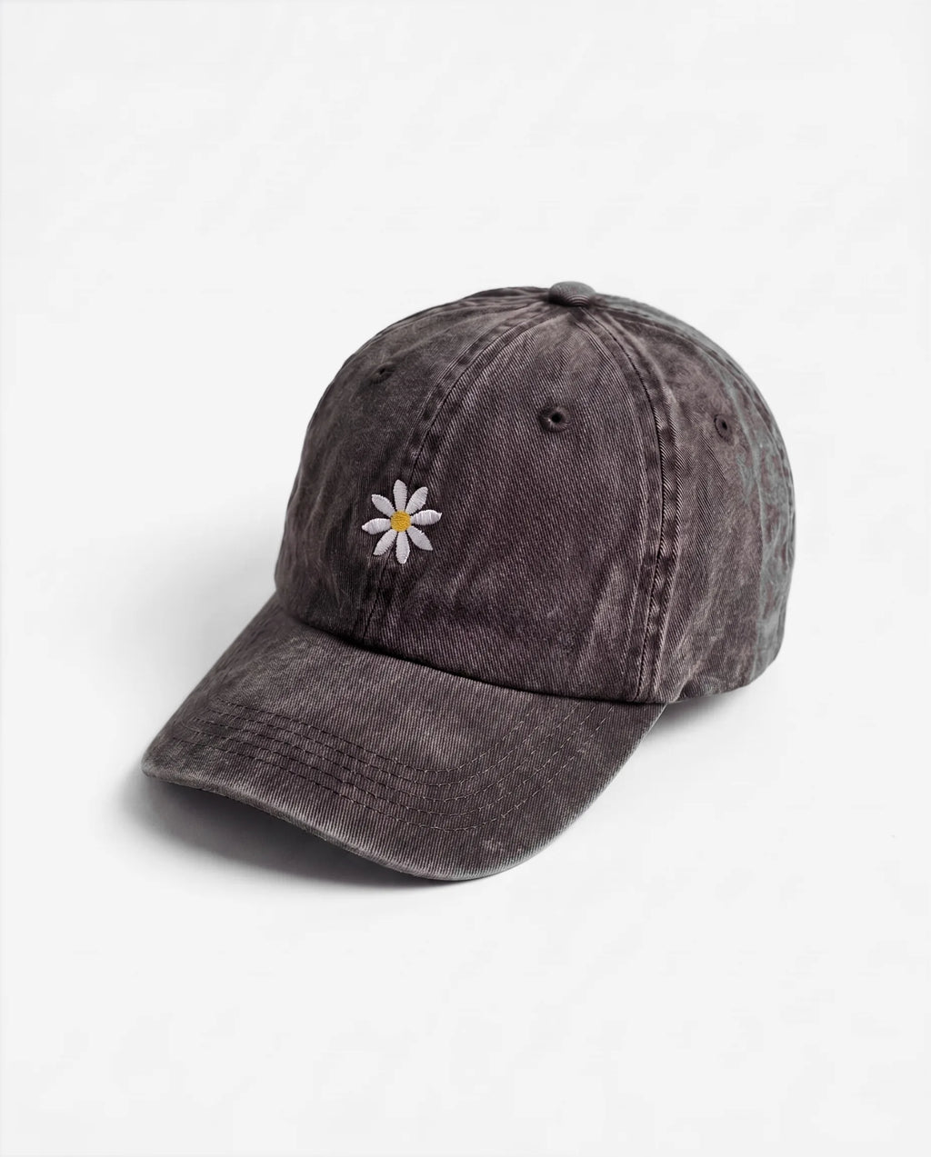The Daisy dad hat in Black, side view: embroidered daisy, washed cotton