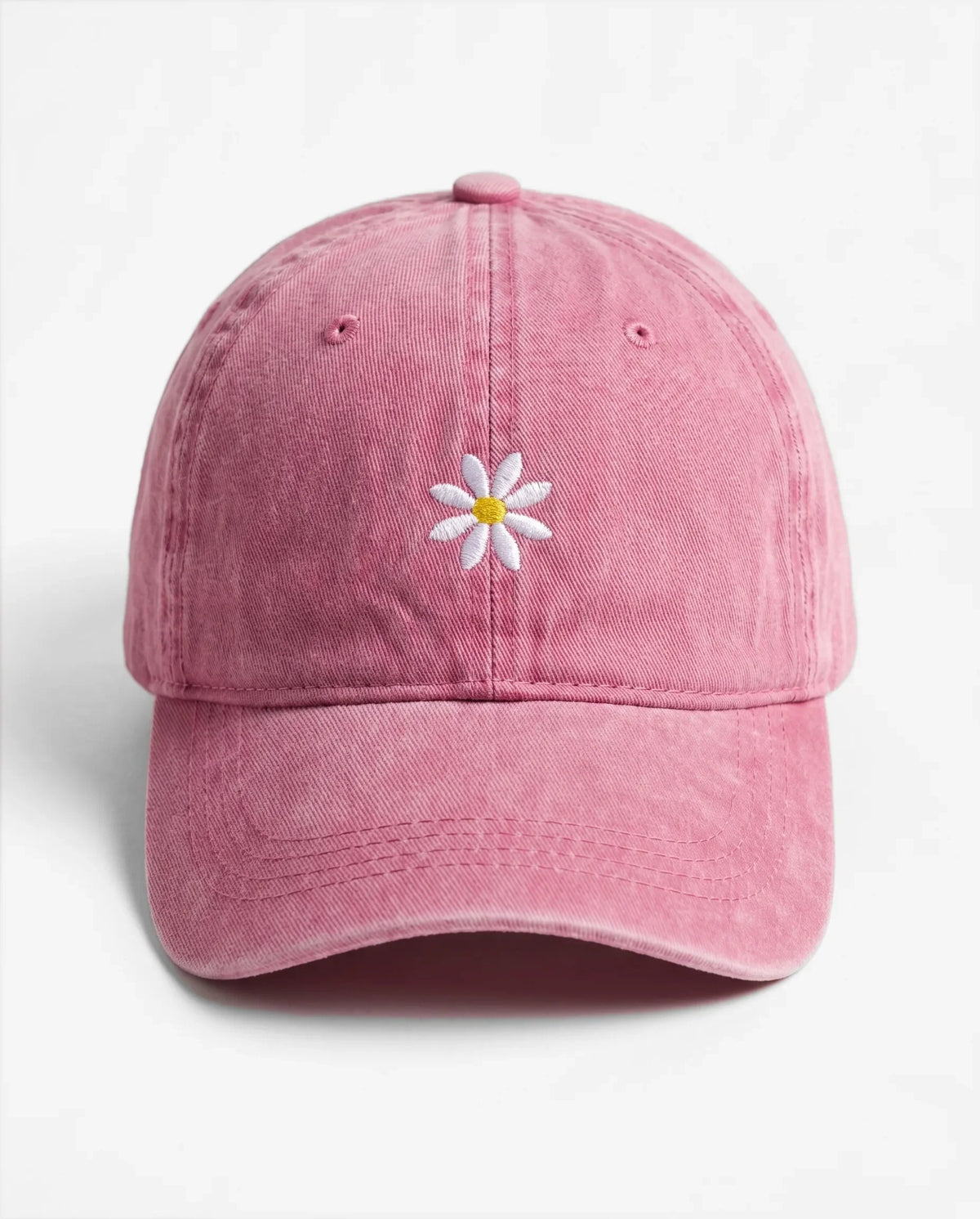 The Daisy dad hat in Rose, front view: embroidered daisy, washed cotton