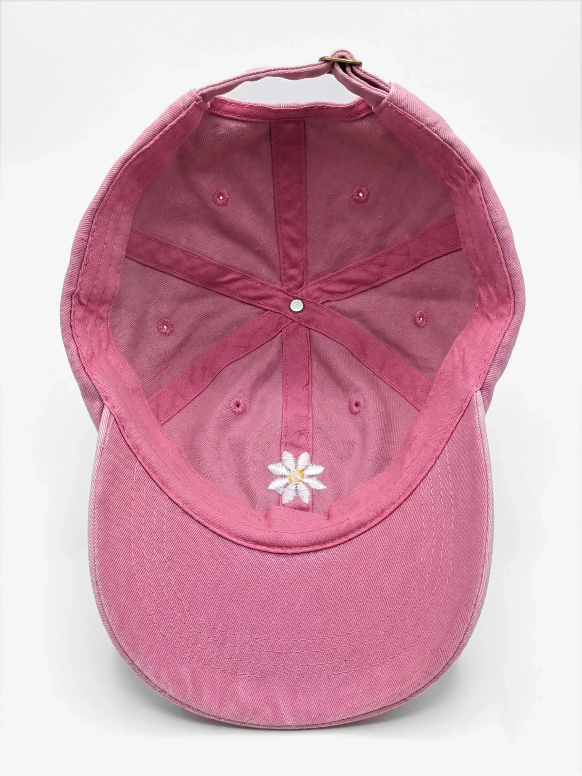 The Daisy dad hat in Rose, inside view with label