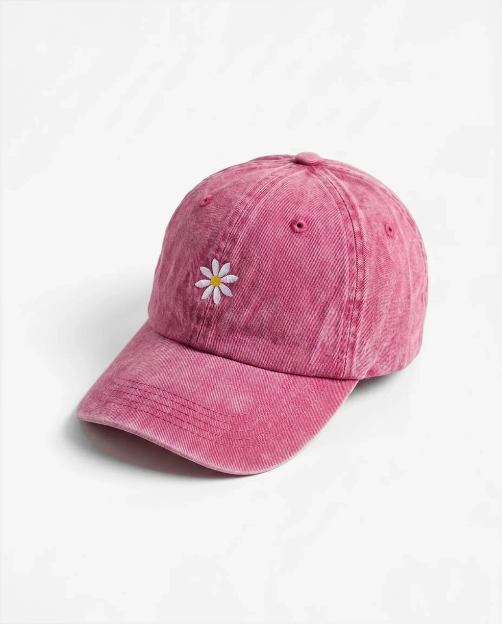 The Daisy dad hat in Rose, side view: embroidered daisy, washed cotton