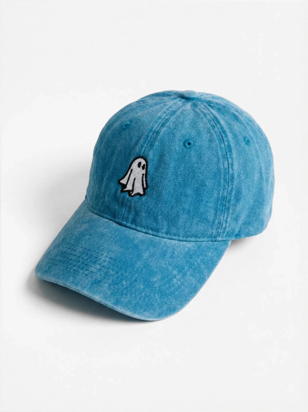 The Ghost dad hat in Lake Blue, side view: embroidered little ghost, washed cotton