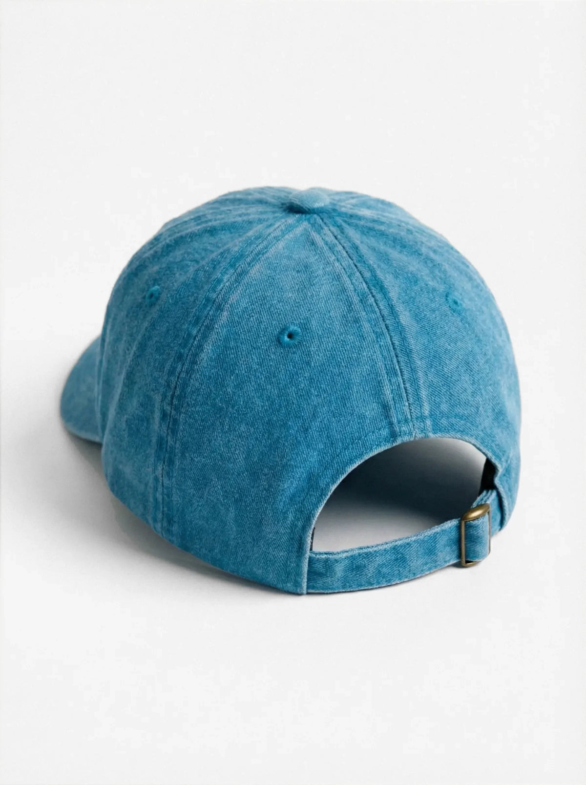 The Ghost dad hat in Lake Blue, back view with brass buckle strap