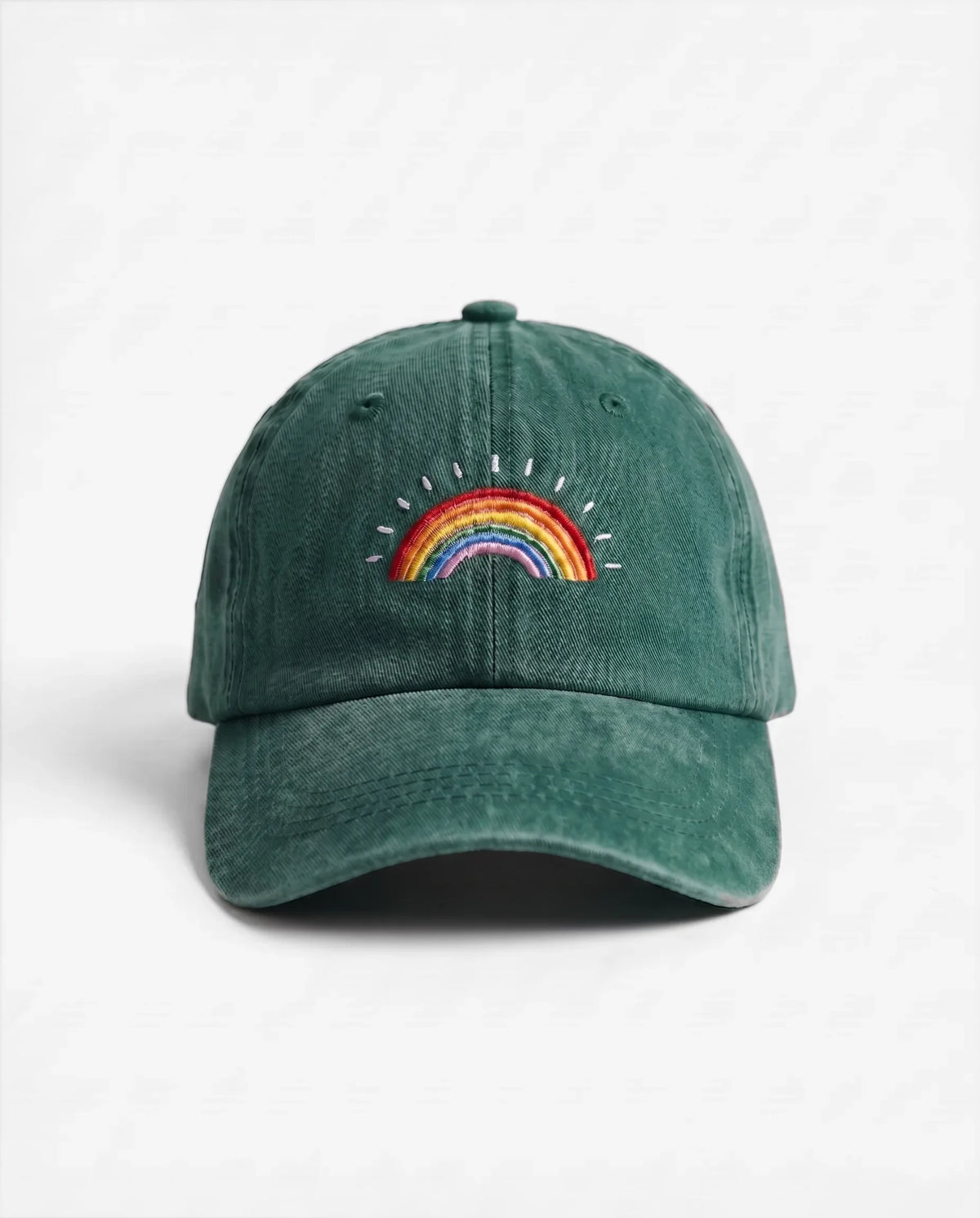 The Rainbow dad hat in Emerald Green, front view: embroidered rainbow, washed cotton