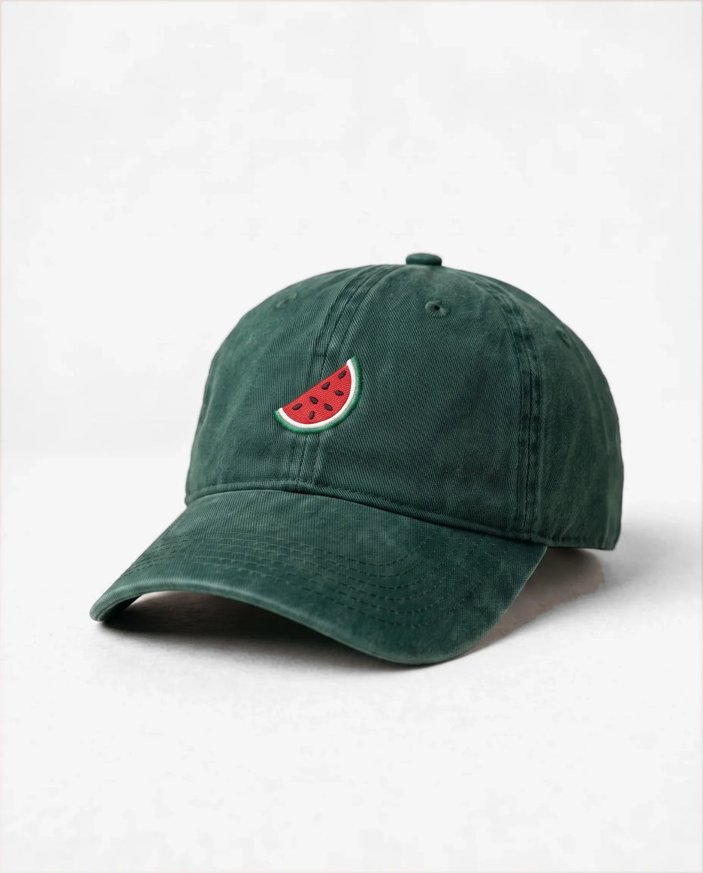 Watermelon dad hat in Emerald Green, three-quarter view: embroidered watermelon slice, washed cotton